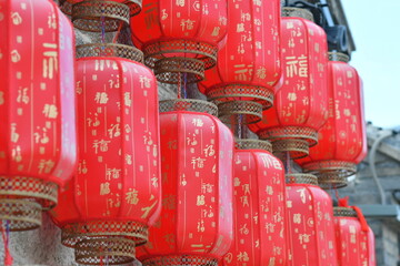 Photo of a traditional Chinese style red lantern. The Chinese word "Fu" on the lantern means blessing. © T shooter