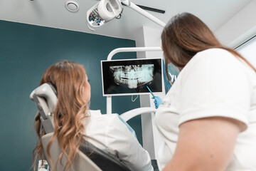 Installation of dental implants is carried out with high accuracy and taking into account the needs of the patient. The dentist carefully analyzes the X-ray of the oral cavity and discusses the