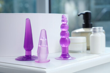 Anal plugs on table in bathroom, closeup