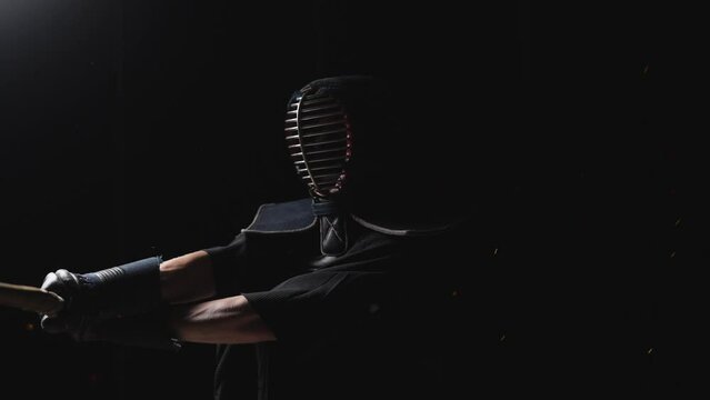 Man Adorned In Kendogu Swinging His Shinai