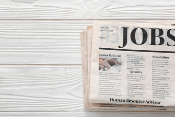 Morning newspapers on white wooden background