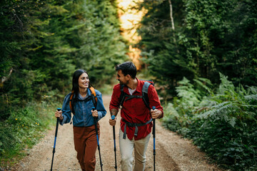 Hikers with gear trekking through scenic wilderness