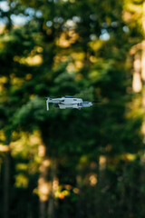 Drone flying in the natural forest.