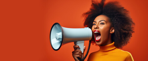 Black woman on a solid orange background shouts into a bullhorn and announces the start of Black Friday Sale Day. Banner - obrazy, fototapety, plakaty