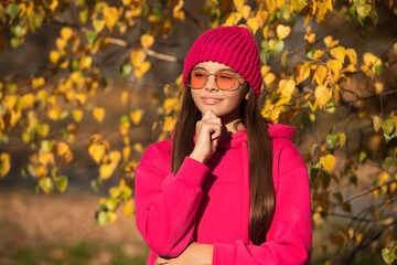 outfit for the fall style. stylish girl in autumn. teen girl has trendy sunglasses. autumn fashion girl. trendy and stylish tween girl outdoor. fall fashion style for teen. Fall foliage