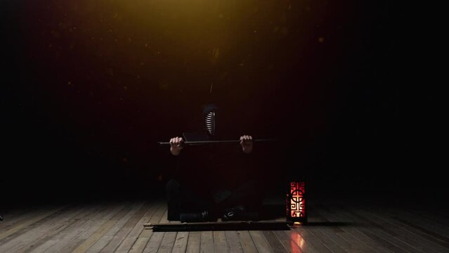 Kendoka Sitting While Sheathing Katana