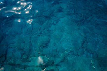 A mesmerizing capture of the unbelievably clear and transparent waters of the Mediterranean at Anthony Quinn Bay, Rhodes. The bay's pristine beauty showcases the true essence of Grecian paradise.