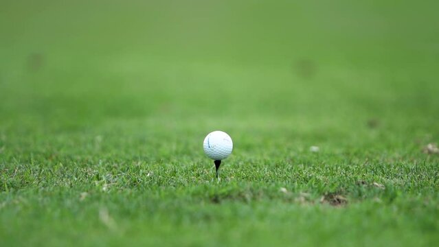 Close Up Of a Golfer Hitting Tee Shot In Slow Motion