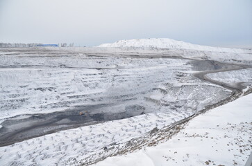 snowy landscape at the site of a coal mining mine