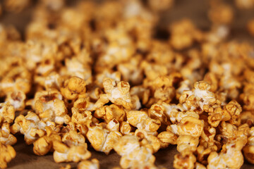 Movie popcorn on brown background, Horizontal image