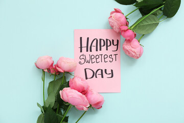 Card with text HAPPY SWEETEST DAY and roses on blue background - obrazy, fototapety, plakaty