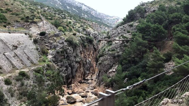 Panning shot: Walking in the rocky valley of Caminito del Rey, El Chorro, Spain.