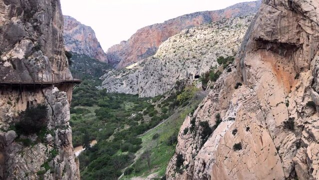 Reveal shot of valley (wide shot), rocky cliffs, Caminito del Rey, El Chorro, Spain.