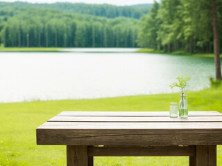 The empty wooden table top with blur background of summer lakes green forest