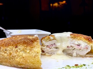 Breaded chicken schnitzel. Schnitzel with cheese sauce