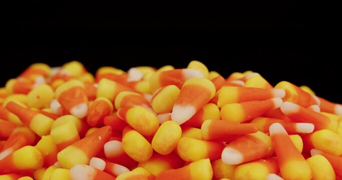 Candy corn pile spinning on turntable closeup