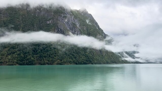 A scene of a very rainy day at Oldevatnet Lake and the Briksdal Valley, Norway