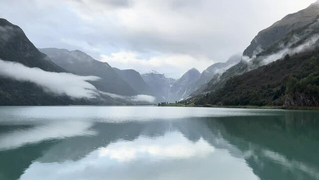 A scene of a very rainy day at Oldevatnet Lake and the Briksdal Valley, Norway