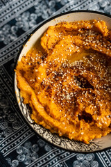 Carrot hummus with zaatar and olive oil