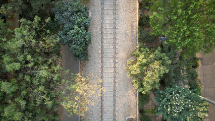 Train tracks in the city from a drone bird eye point of view