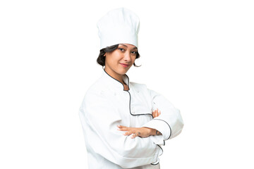 Young chef Argentinian woman over isolated background with arms crossed and looking forward