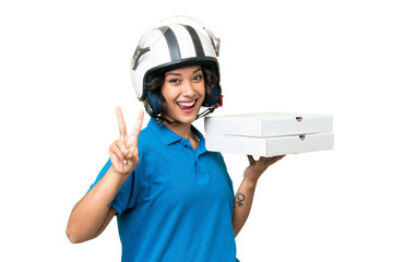 Pizza delivery Argentinian woman with work uniform picking up pizza boxes over isolated background...