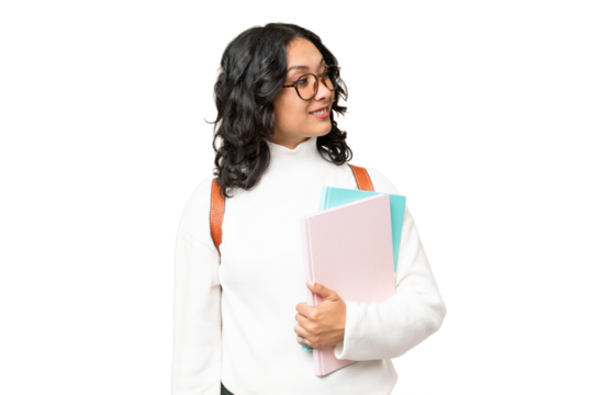Young Argentinian student woman over isolated background looking to the side and smiling