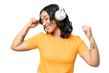 Young caucasian Argentinian woman over isolated background listening music and dancing