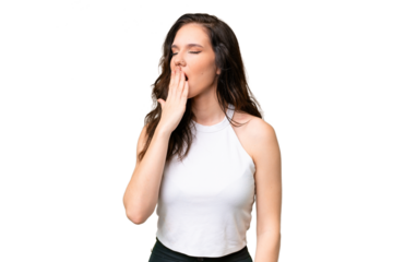 Young caucasian woman isolated over isolated background yawning and covering wide open mouth with hand