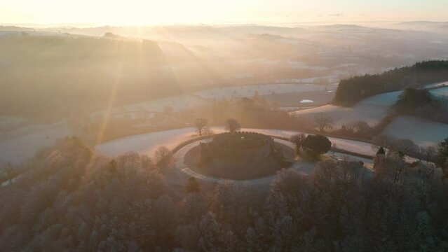 Aerial of Restormel Castle at dawn on a frosty winter morning, Cornwall, England