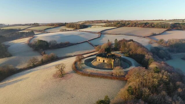 Aerial of Restormel Castle at dawn on a frosty winter morning, Cornwall, England