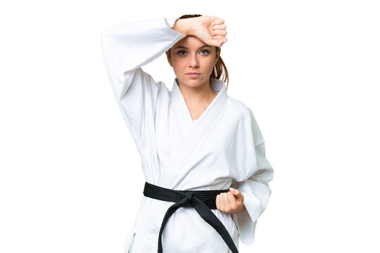 Young blonde woman over isolated chroma key background doing karate