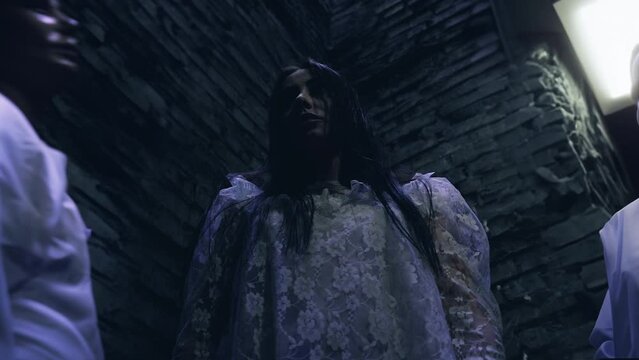 Woman robot standing in a dark storage with other cyborgs, creepy horror scene. Terrifying human doll, cyborg gains consciousness, Halloween