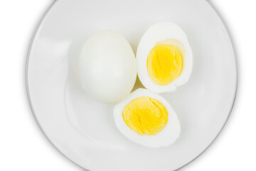 boiled egg on a plate over white background