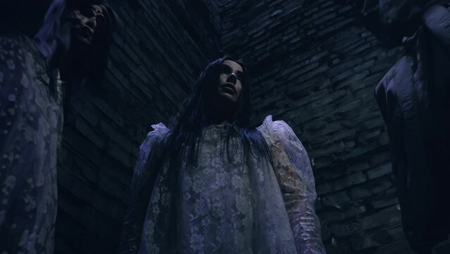 Woman cyborg awakens in a dark storage with motionless figures of other robots. Creepy human doll, cyborg, horror scene, Halloween