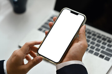 Close up businessman hands holding smartphone with blank screen for apps advertising or promotional content