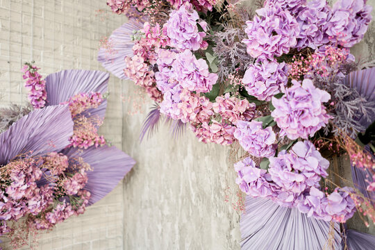 Decorate wall backdrop of artificial leaf and hydrangea. It is wedding time. Lilac and violet colors. hydrangea , beautiful spring bouquet.