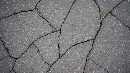 The texture of asphalt with cracks