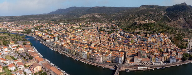 Panoramic drone point of view of the Italian village of Bosa complete with the Temo River and...