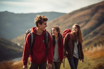 A group of teenagers hiking and enjoying nature, a group of young friends exploring the great outdoors in the mountains, embracing an active lifestyle in nature.