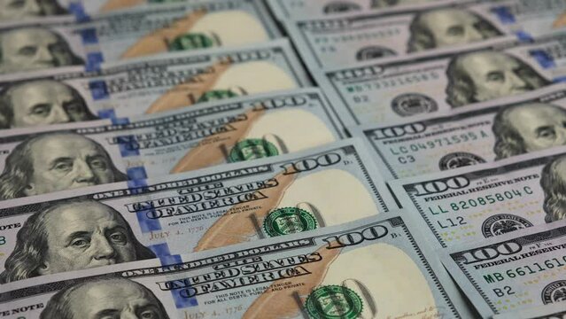 Close-up many 100 American dollar bills. Conceptual image.