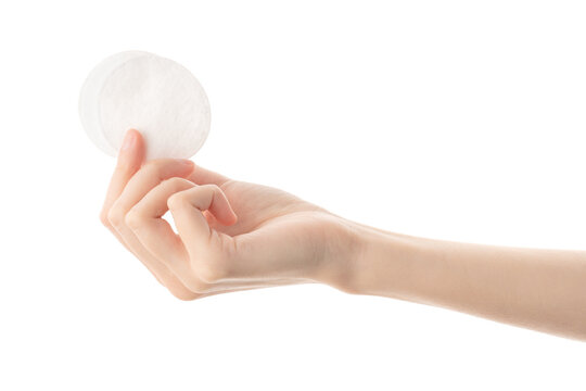 Round Cotton Pads In A Female Hand, Isolated On A White Background. Disposable Personal Hygiene Products. Healthy Lifestyle. Hygiene. Health.