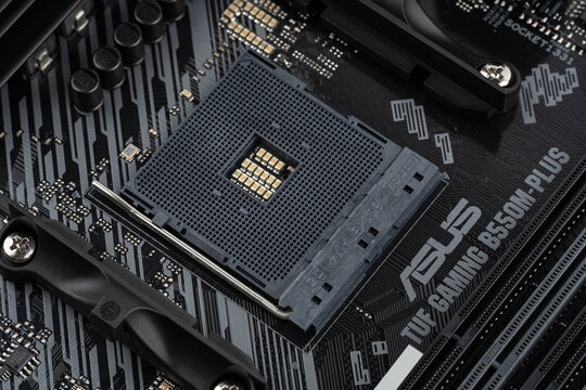 Dnipro, Ukraine - April 10st, 2023: ASUS TUF Gaming B550M-Plus on white background. TUF - The Ultimate Force - gaming line of productive computer equipment from the company Asus.