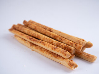 Cheese Sprinkle Stick Cookies are neatly presented and isolated against a white background.