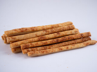 Cheese Sprinkle Stick Cookies are neatly presented and isolated against a white background.