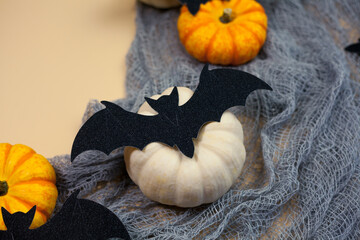 Halloween. Decor for the autumn holidays. Small pumpkins. Background. Fall.