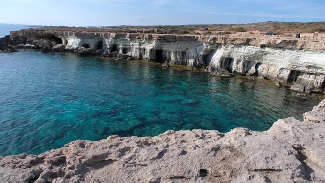 Emerald transparent sea and caves in the Blue Lagoon in Ayia Napa on the island of Cyprus