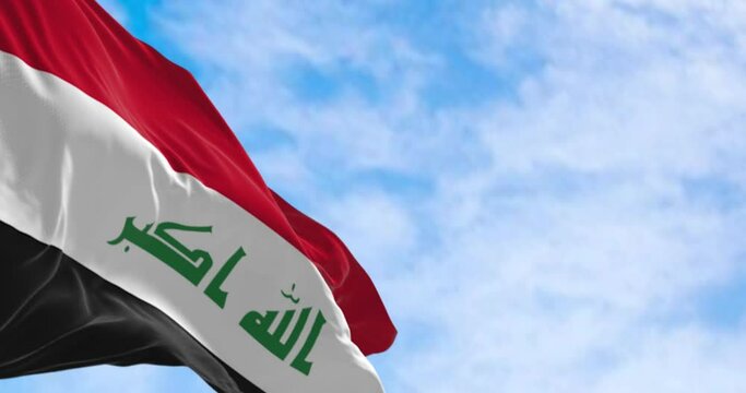 Republic of Iraq national flag waving on a clear day