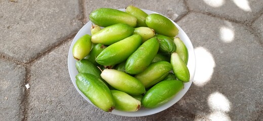 Harvest pile Averrhoa bilimbi or Bilimbi fruits or Belimbing wuluh or belimbing sayur plants. In indonesia use as ingredient cooking