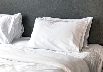 Fototapeta na wymiar comfortable bed with soft white pillows, Pillows in hotels